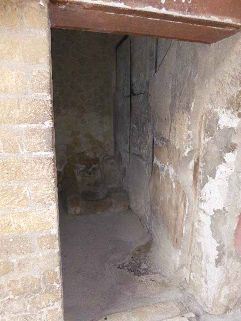 According to Maiuri, the latrine would have been in the north-east corner, visible at the end of the room in this photo.